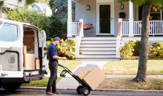 Courier Knocking On Door Of House To Deliver Package