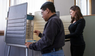 Man and woman voting
