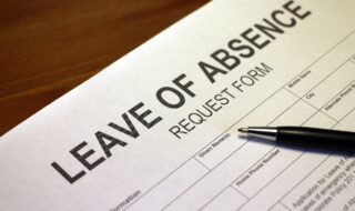 Someone filling out Leave of Absence Request Form.