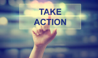 Hand pressing Take Action