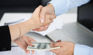 Woman and man handshake close up