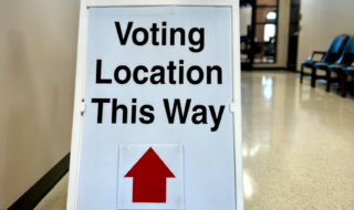 Voting location this way sign. Voting. Election. Vote. Photo by Todd Pack